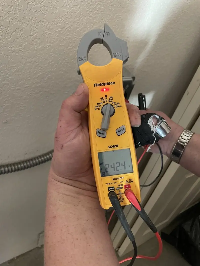 Voltage testing with clamp meter during Recessed Lighting Installation in Millington